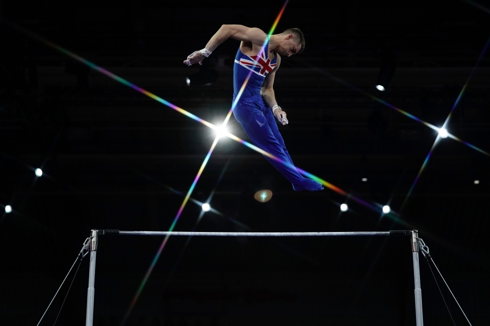 Great Britain's Max Whitlock performs on the horizontal bar during the men's qualifying session at the FIG Artistic Gymnastics World Championships at the Hanns-Martin-Schleyer-Halle in Stuttgart, southern Germany, on Monday. — AFP