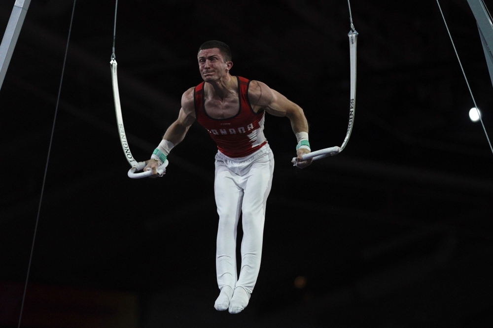 Great Britain's Max Whitlock performs on the horizontal bar during the men's qualifying session at the FIG Artistic Gymnastics World Championships at the Hanns-Martin-Schleyer-Halle in Stuttgart, southern Germany, on Monday. — AFP
