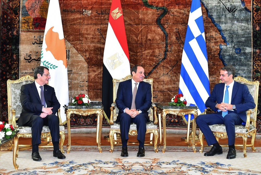A handout picture released by the Egyptian Presidency shows Egyptian President Abdel Fattah El-Sisi, center, President of Cyprus Nicos Anastasiades, left, and  Greek Prime Minister Kyriakos Mitsotakis, right,  during their meeting in the capital Cairo on Tuesday. — AFP