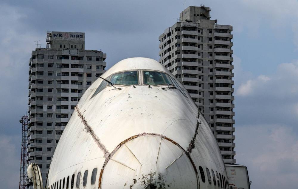 An abandoned aircraft is seen in the suburbs of Bangkok on October 9, 2019. The area, known as the 