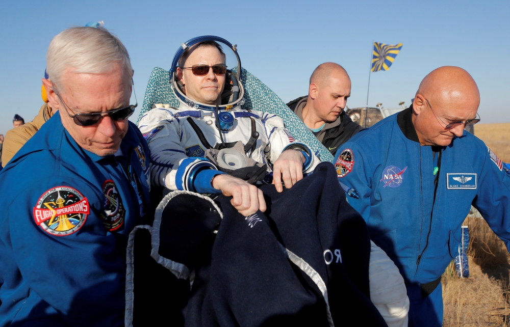 NASA specialists carry US astronaut Nick Hague, returning from a mission to the International Space Station, shortly after the landing of the Russian Soyuz MS-12 space capsule near the town of Zhezkazgan, Kazakhstan, in this Oct. 3, 2019 file photo. — Reuters