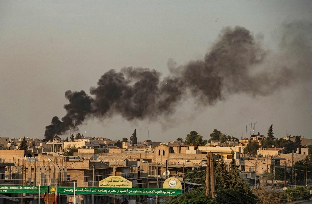 Smoke billows following Turkish bombardment on Syria's northeastern town of Ras Al-Ain in the Hasakeh province along the Turkish border on Wednesday. — AFP