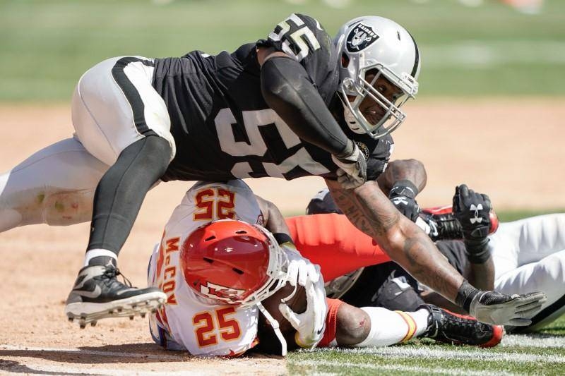 Oakland Raiders linebacker Tahir Whitehead (59) and linebacker Vontaze Burfict (55) tackles Kansas City Chiefs running back LeSean McCoy (25) during the second quarter at the Oakland Coliseum, California, in this Sept. 15, 2019 file photo. — Reuters