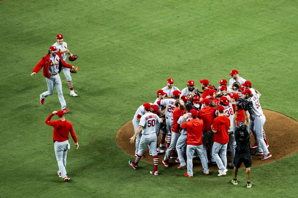 The St. Louis Cardinals celebrate winning Game Five of the National League Division Series over the Atlanta Braves 13-1 at SunTrust Park in Atlanta, Georgia, on Wednesday. — AFP