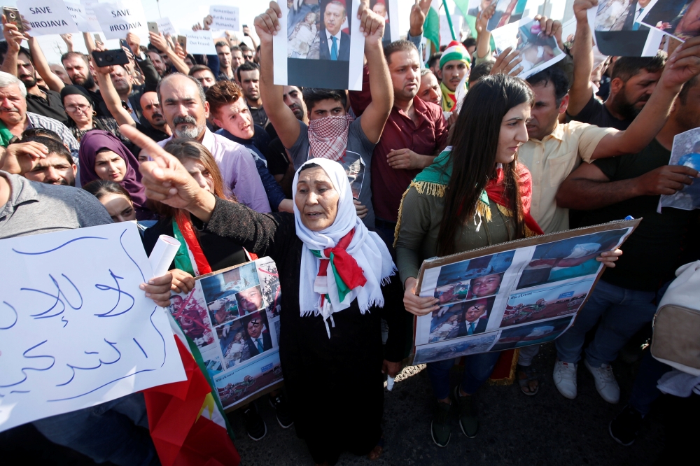 Syrian Kurds protest the Turkish offensive against Syria during a demonstration in front of the United Nation Headquarter in Erbil, Iraq on Thursday. — AFP