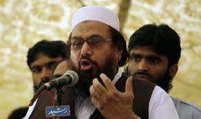 Pakistani authorities on Thursday arrested four aides of Islamist leader Hafiz Saeed, seen in this file photo, on terrorism financing charges, counter-terrorism police said.