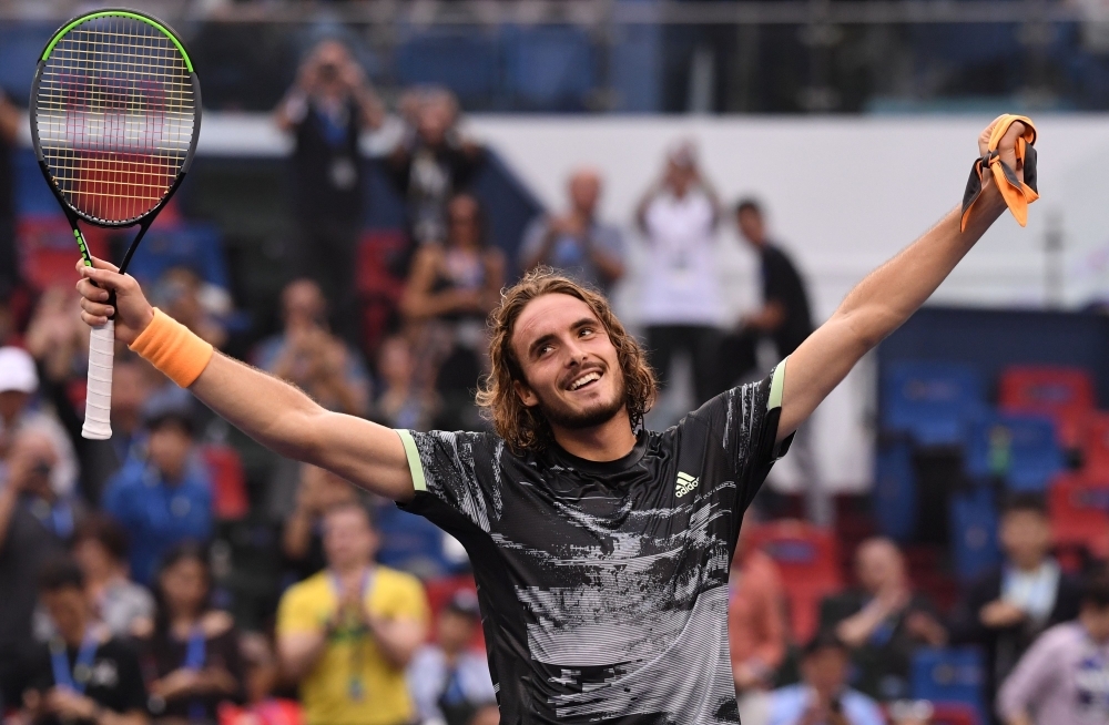 Stefanos Tsitsipas of Greece celebrates after winning against Novak Djokovic of Serbia during their men's singles quarter-final match at the Shanghai Masters tennis tournament in Shanghai on Friday. — AFP