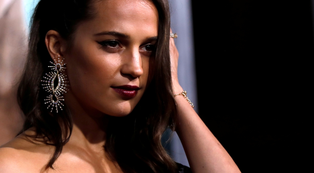 Cast member Alicia Vikander poses at the premiere for 