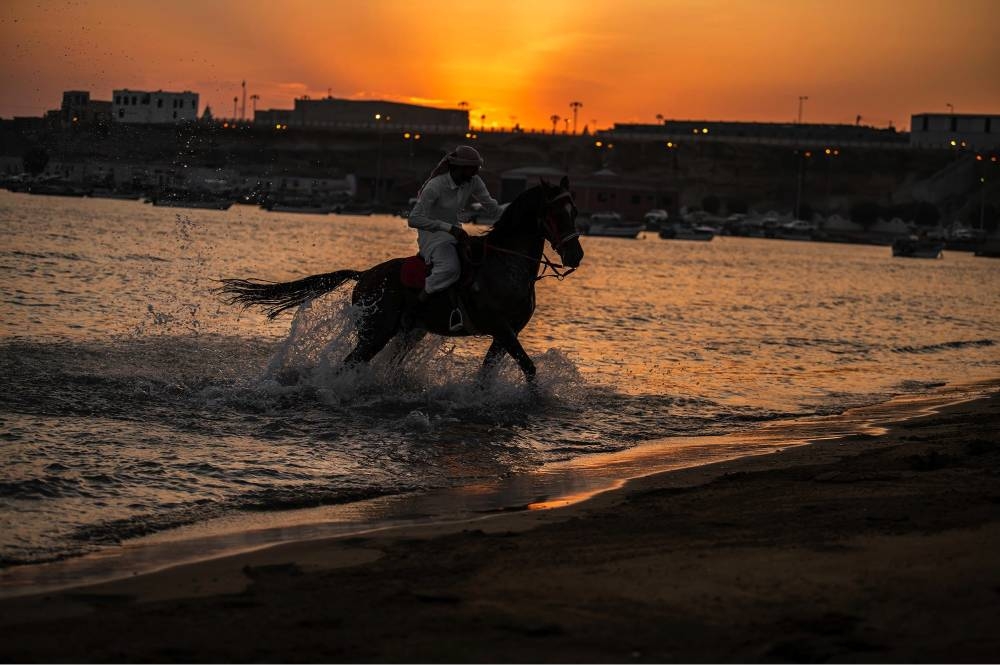A horseman in Al-Wajh governorate pursuing his hobby of horse riding on the beach. — SPA

