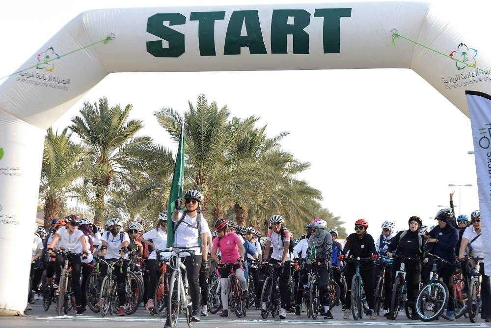 Women take part in a cycling race to mark World Obesity Day celebration in Riyadh's Princess Noura University, Friday. — AFP 