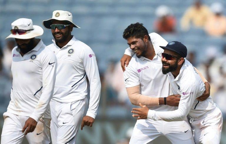 Indian players celebrate the wicket of South African Vernon Philander en route to victory in the second Test in Pune, on Sunday. — AFP 