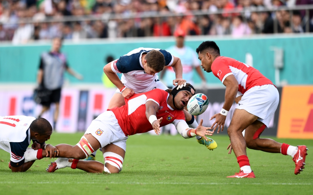 Tonga's Zane Kapeli in action with Ruben De Haas of the US and Marcel Brache of the US during the Rugby World Cup 2019 Pool C at Hanazono Rugby Stadium, Osaka, Japan, on Sunday. — Reuters