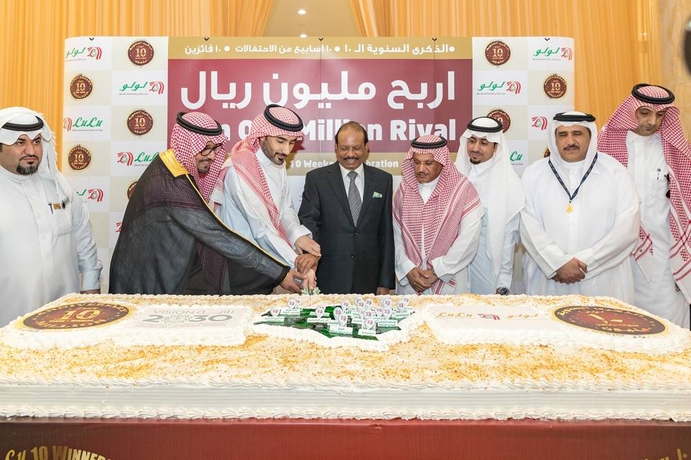 Chairman Yusuffali MA of LuLu Group leads the cutting of the ceremonial cake during the 10th anniversary celebrations held at Atayaf Mall in Riyadh
