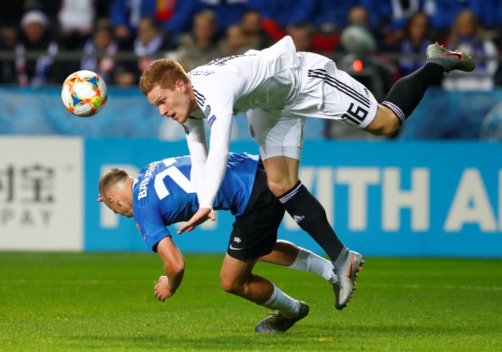Germany's Marcel Halstenberg in action with Estonia's Nikita Baranov during Euro 2020 Qualifier Group C in  Tallinn, Estonia, on Sunday. — Reuters

