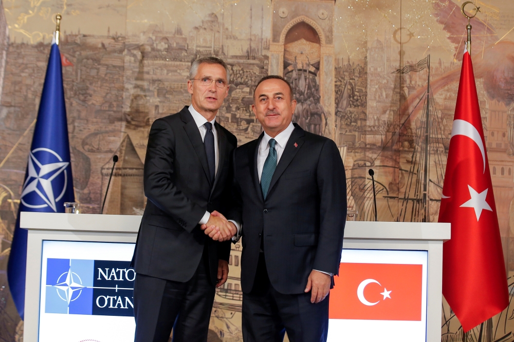 Turkish Foreign Minister Mevlut Cavusoglu, right, shakes hands with NATO Secretary-General Jens Stoltenberg after a news conference in Istanbul, Turkey, in this Oct. 11, 2019 file photo. — Reuters
