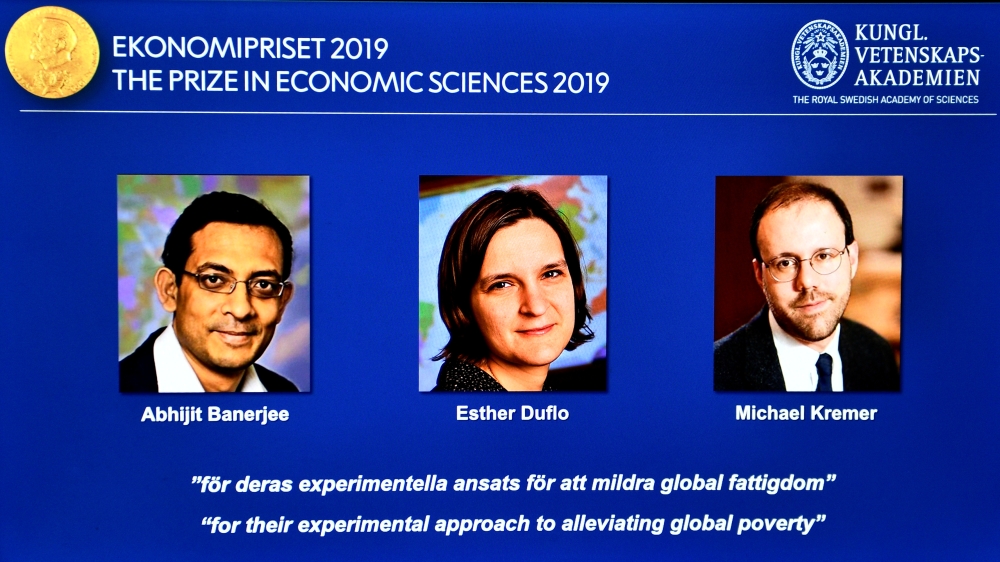 The portraits of Abhijit Banerjee, right, Esther Duflo, center, and Michael Kreme, who have been announced the Nobel Prize in Economic Sciences 2019 winners, are seen at a news conference at the Royal Swedish Academy of Sciences in Stockholm, Sweden, on Monday. — Reuters
