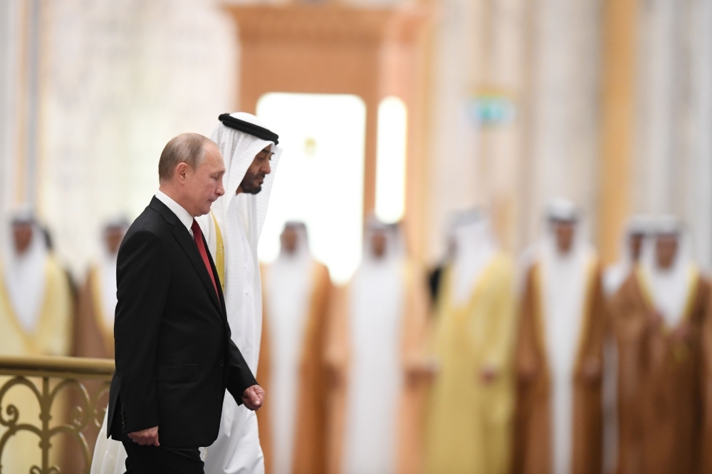 Russian President Vladimir Putin, right, is received by Abu Dhabi's Crown Prince Mohammed Bin Zayed during an official welcoming in the Emirati capital's Al-Watan presidential palace on Tuesday. — AFP
