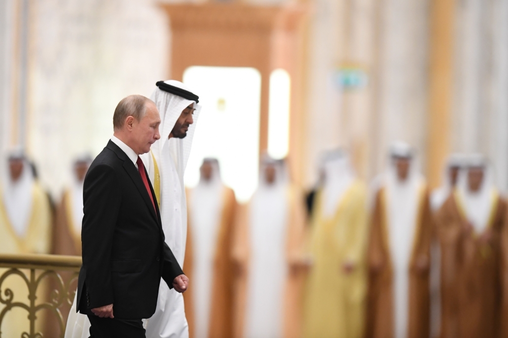 Russian President Vladimir Putin, right, is received by Abu Dhabi's Crown Prince Mohammed Bin Zayed during an official welcoming in the Emirati capital's Al-Watan presidential palace on Tuesday. — AFP