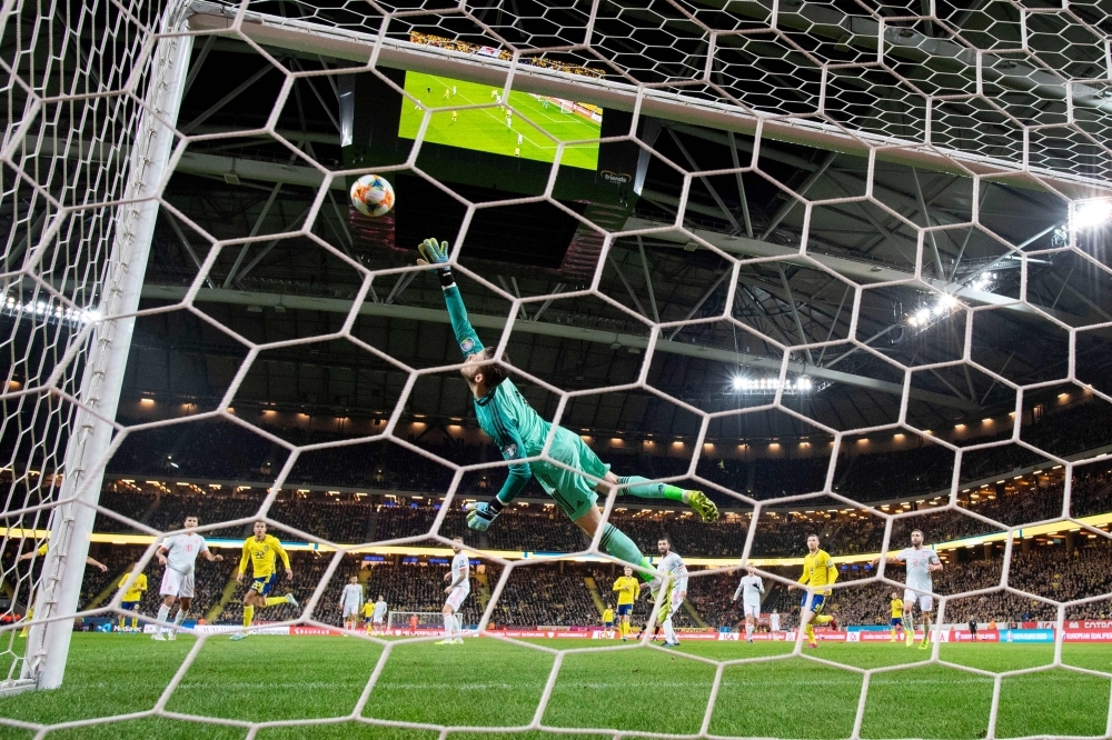 Spain's goalkeeper David de Gea makes a save during the Euro 2020 Group F qualification football match between Sweden and Spain at Friends Arena in Stockholm, on Tuesday. — AFP