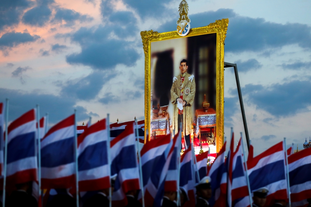 Military cadets hold up Thai national flags as they gather outside the Grand Palace to celebrate the 67th birthday of Thai King Maha Vajiralongkorn in Bangkok, Thailand, in this July 28, 2019 file photo. — Reuters