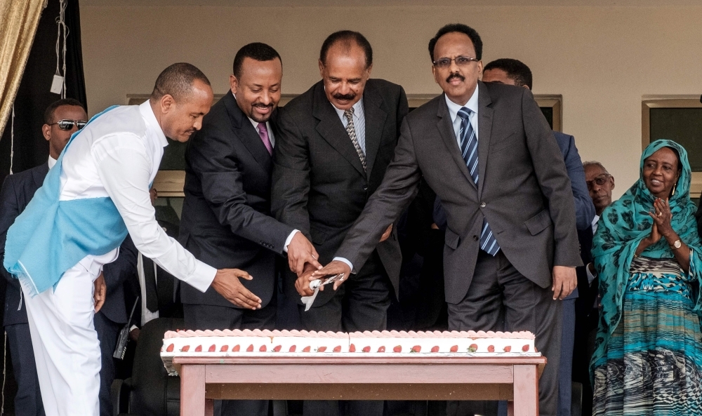 Eritrea's President Isaias Afwerki, second right, Ethiopia's Prime Minister Abiy Ahmed, second left, and Somalia's President Mohamed Abdullahi Mohamed, right, cut a ceremonial cake together during the inauguration of the Tibebe Ghion Specialized Hospital in Bahir Dar, northern Ethiopia, in this Nov. 10, 2018 file photo. — AFP