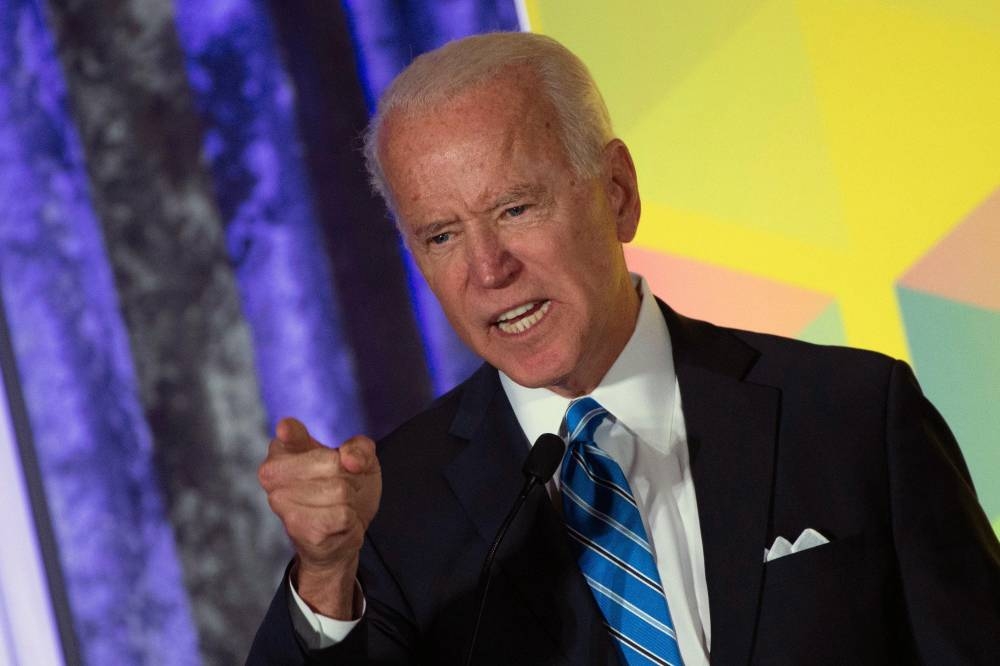 2020 Democratic presidential hopeful former US Vice President Joe Biden gestures as he speaks during the Women's Leadership Forum Conference on Oct. 17, 2019 in Washington DC. — AFP