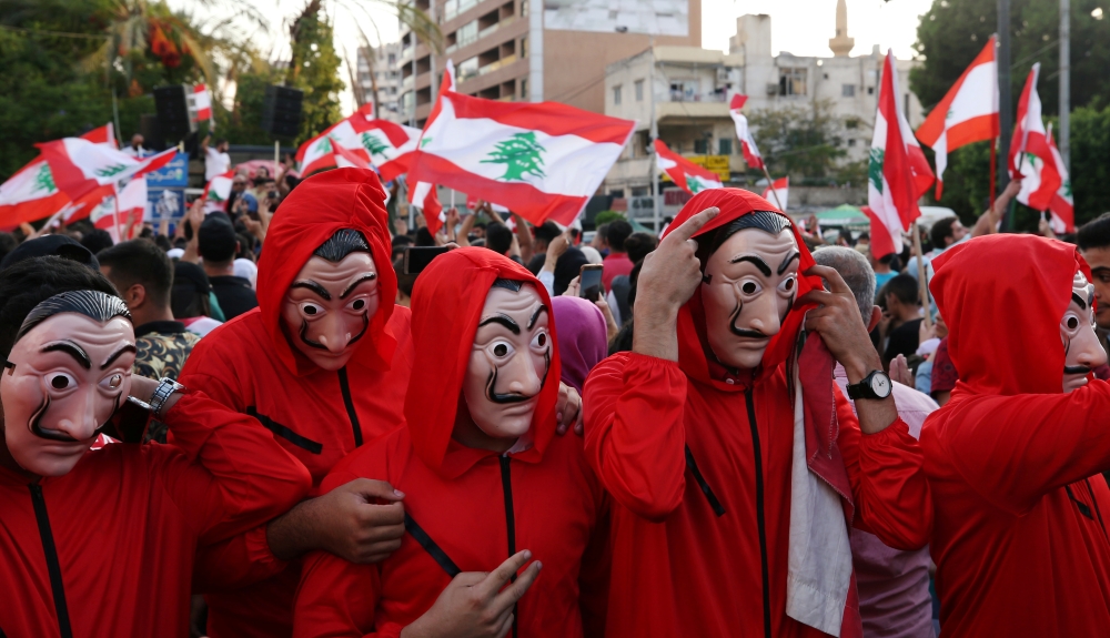 Demonstrators wearing costumes take part in an anti-government protest in the port city of Sidon, Lebanon, Saturday. — Reuters