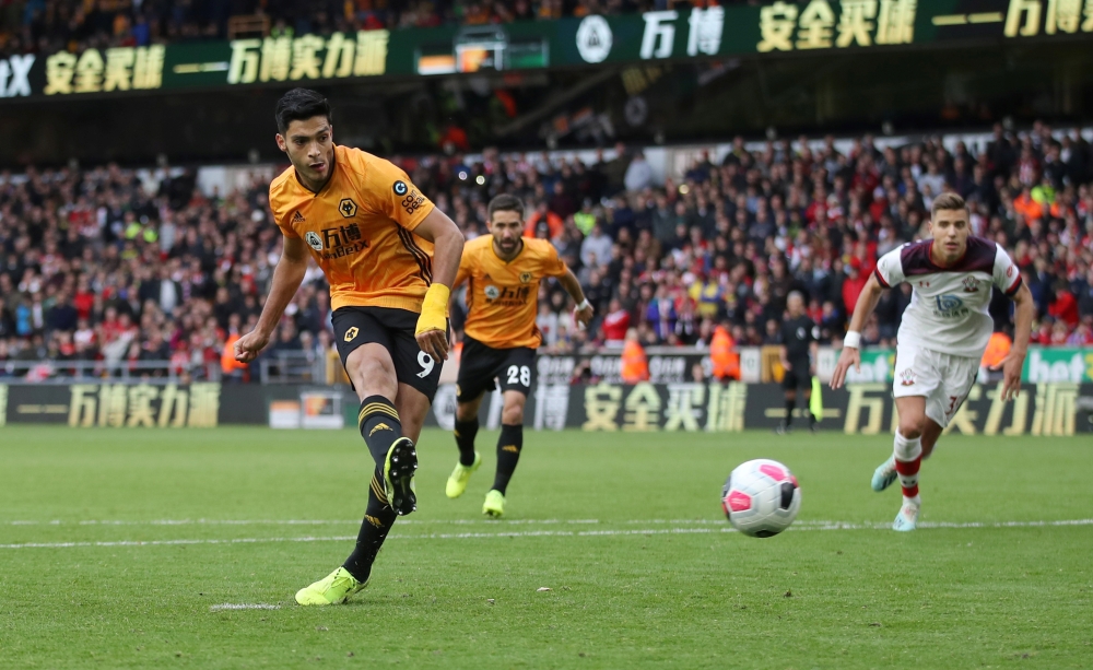 Wolverhampton Wanderers' Raul Jimenez scores their first goal from the penalty spot against Southampton at Molineux Stadium, Wolverhampton, Britain, on Saturday. — Reuters
