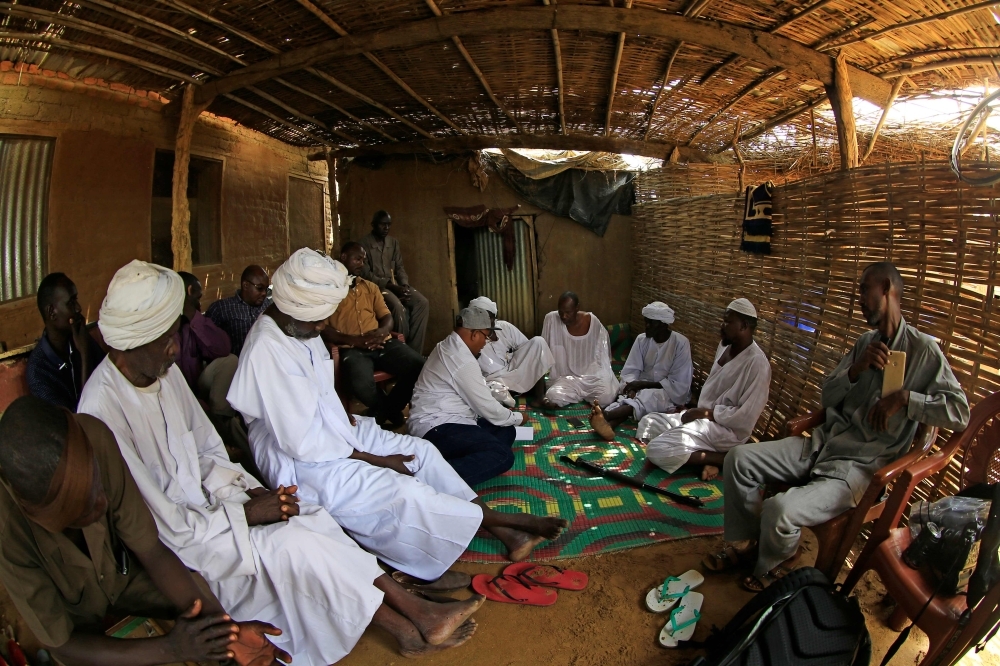 Residents of the Kalma camp for displaced people near Niyala, the provincial capital of South Darfur state, gather in a makeshift shelter, Sunday. The fighting in the Darfur region of Western Sudan broke out when ethnic African rebels took up arms against Khartoum's then Arab-dominated government of Omar Al-Bashir, alleging racial discrimination, marginalization and exclusion. — AFP