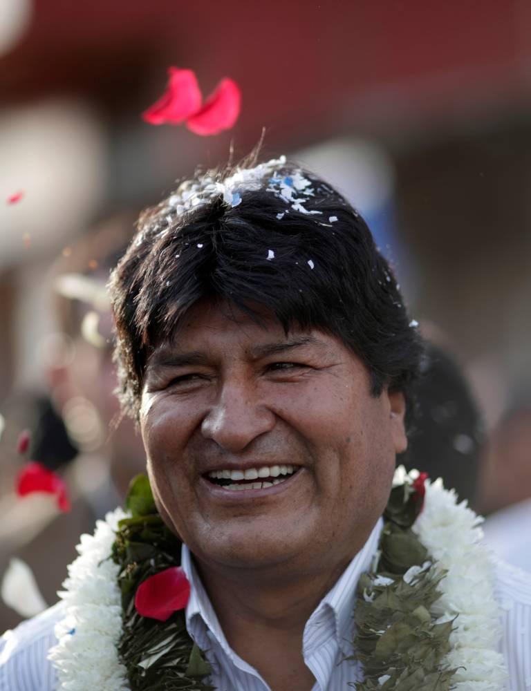 Bolivia's President and candidate Evo Morales of the Movement Toward Socialism (MAS) arrives to vote during the presidential election at a polling station in a school in Villa 14 de Septiembre, in the Chapare region, Sunday. — Reuters