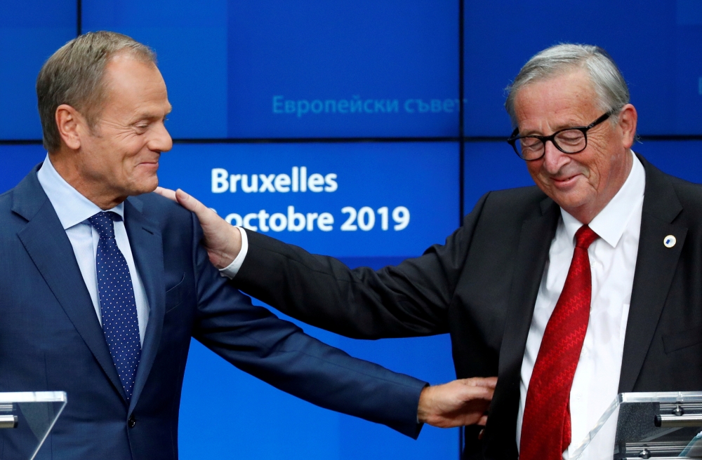 European Commission President Jean-Claude Juncker and European Council President Donald Tusk attend a joint news conference with European Union's chief Brexit negotiator Michel Barnier and Ireland's Prime Minister (Taoiseach) Leo Varadkar at the European Union leaders summit, in Brussels, Belgium Oct. 17, 2019. Reuters