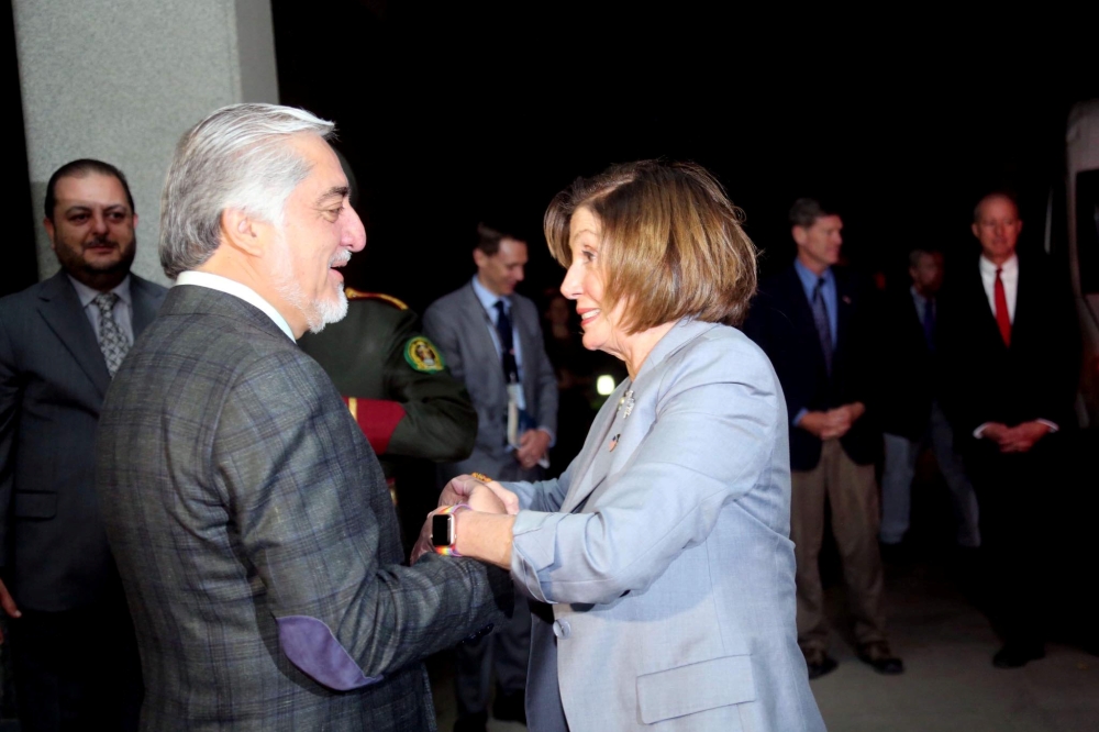 US House Speaker Nancy Pelosi shakes hand with Afghanistan Chief Executive Abdullah Abdullah in Kabul, Afghanistan, on Sunday. — Reuters