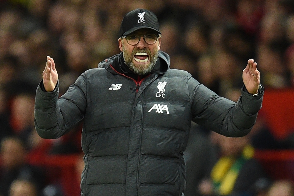 Liverpool's German manager Jurgen Klopp gestures on the touchline during the English Premier League football match between Manchester United and Liverpool at Old Trafford in Manchester, north west England, on Sunday. — AFP