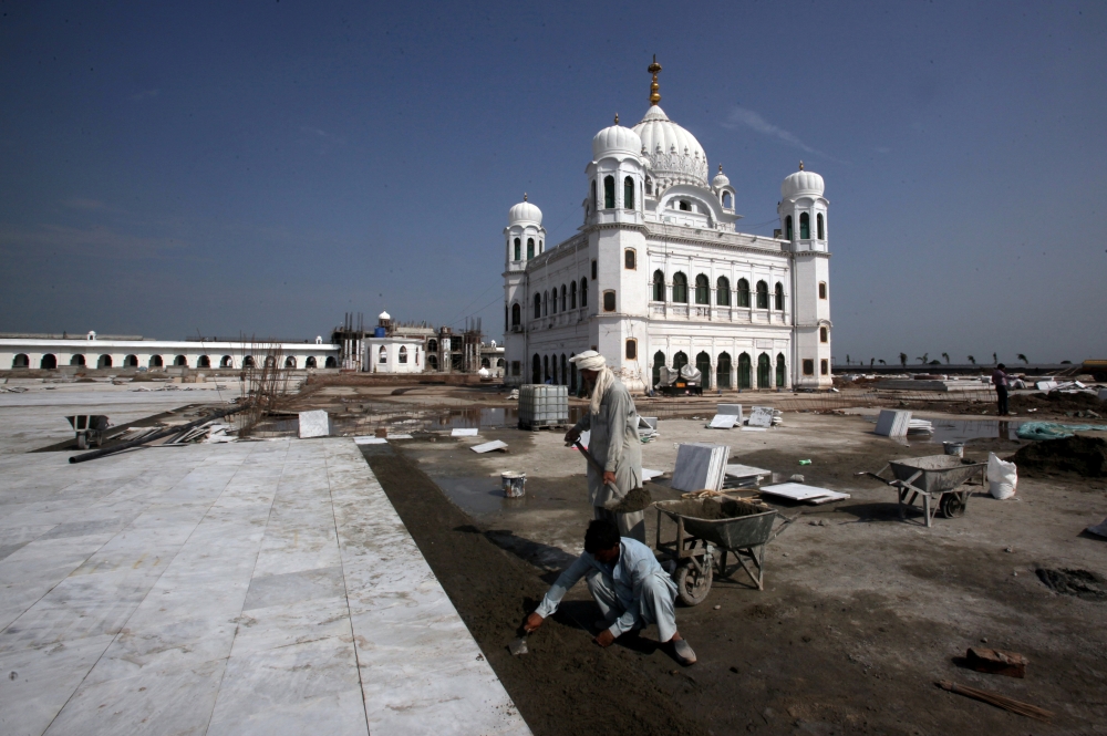 Laborers work at the sites of the Gurdwara Darbar Sahib, which will be open this year for Indian Sikh pilgrims, in Kartarpur, Pakistan, in this Sept. 16, 2019 file photo. — Reuters