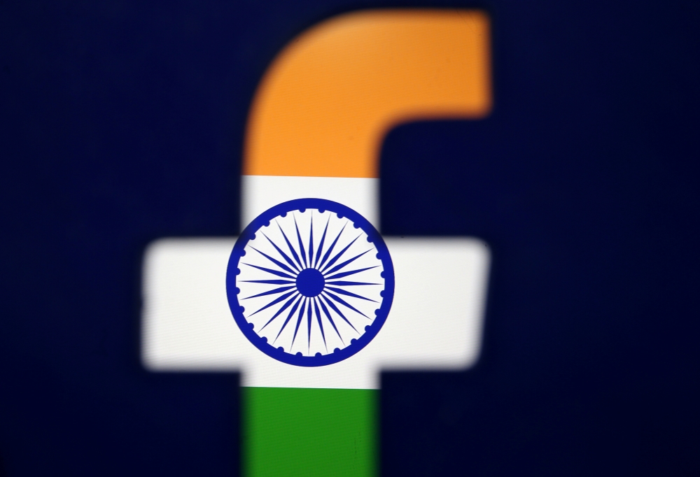 India's flag is seen through a 3D printed Facebook logo in this illustration picture on April 8, 2019. — Reuters