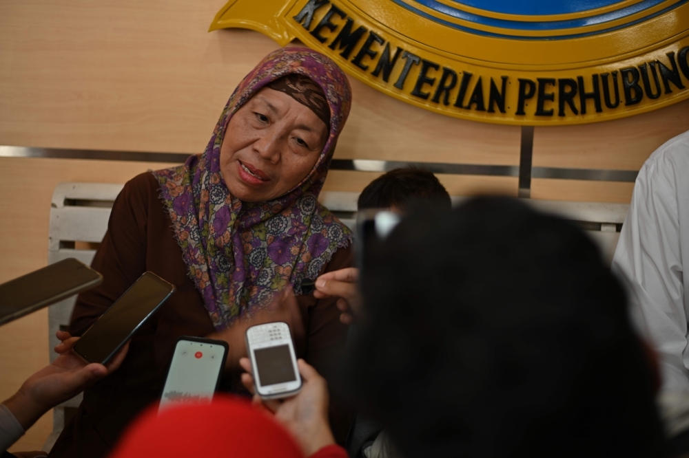 Nurjannah, the mother of air attendant instructor Denny Maulana who was killed when Lion Air flight 610 on Oct. 29, 2018 crashed into the sea shortly after takeoff, speaks to journalists before a meeting between families of victims and Indonesia's National Transportation Safety Committee in Jakarta on Wednesday. — AFP