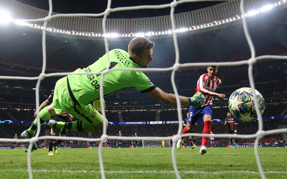 Atletico Madrid's Alvaro Morata scores their first goal against Bayer Leverkusen at Wanda Metropolitano, Madrid, Spain, on Tuesday. — Reuters