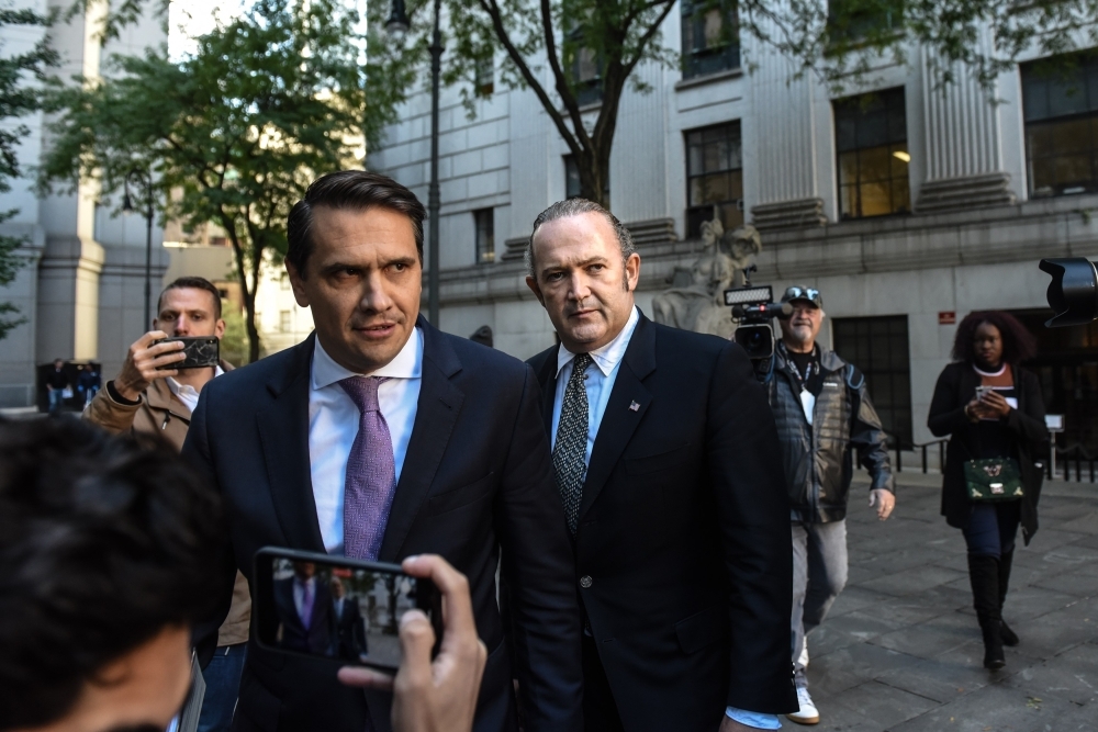 Igor Fruman (C) exits federal court for an arraignment hearing on October 23, 2019 in New York City. Lev Parnas and Igor Fruman, along with Andrey Kukushkin and David Correia, are associates of Rudy Giuliani who have been arrested for allegedly conspiring to circumvent federal campaign finance laws in schemes to funnel foreign money to US candidates running for office at the federal and state levels. — AFP