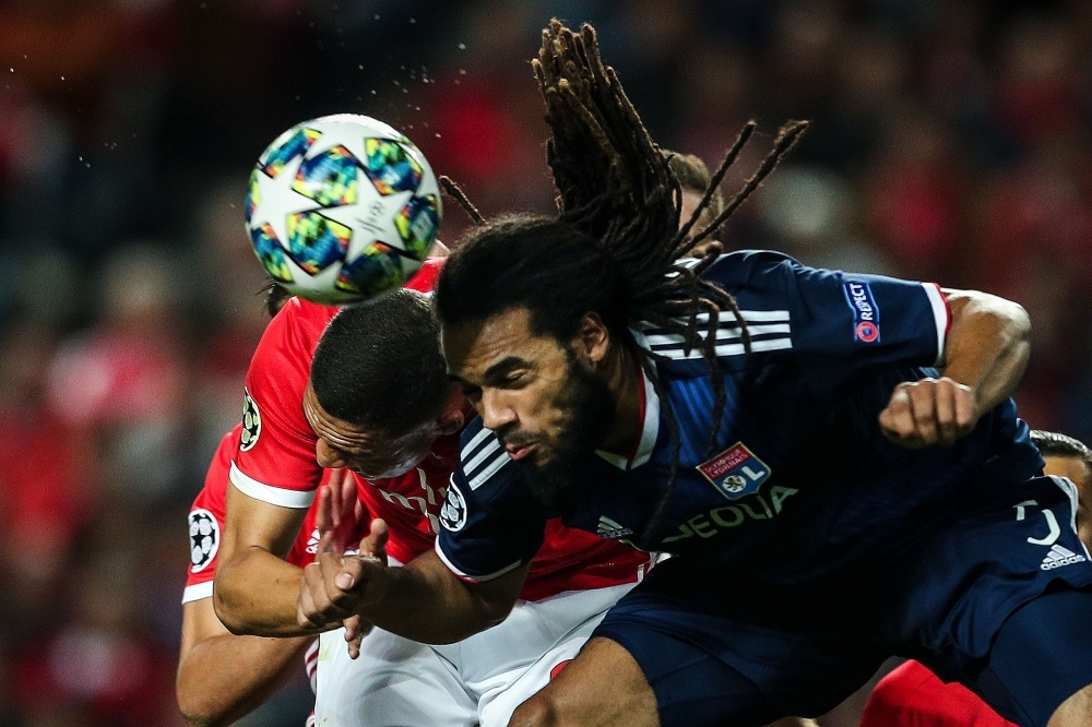 Benfica's Brazilian forward Carlos Vinicius (L) vies with Lyon's Belgian defender Jason Denayer during the UEFA Champions League Group G football match SL Benfica against Olympique Lyonnais at Luz Stadium in Lisbon Wednesday. — AFP