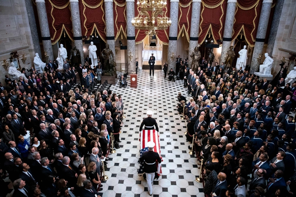The American flag-draped casket of late Maryland Representative Elijah Cummings is carried through National Statuary Hall during a memorial service at the US Capitol in Washington, DC on Thursday. Cummings died on Oct. 17, 2019.  — AFP
