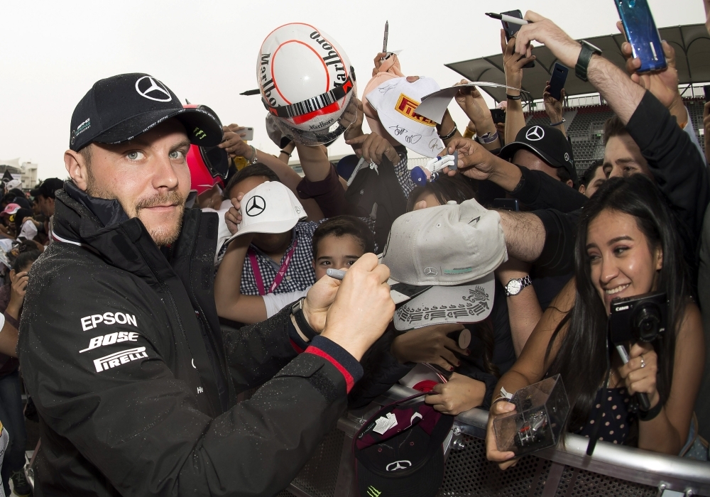 Mercedes Benz's Finnish driver Valtteri Bottas signs autographs at the Hermanos Rodriguez circuit in Mexico City on Thursday, ahead of the weekend's Grand Prix. — AFP 