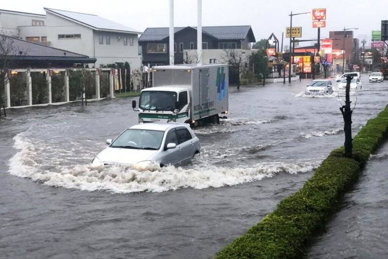 A street is flooded by heavy rain in Narita, east of Tokyo, on Friday. — Courtesy photo