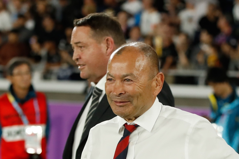 England's head coach Eddie Jones (R) and New Zealand's head coach Steve Hansen react after the Japan 2019 Rugby World Cup semifinal match between England and New Zealand at the International Stadium Yokohama in Yokohama, on Saturday. — AFP
