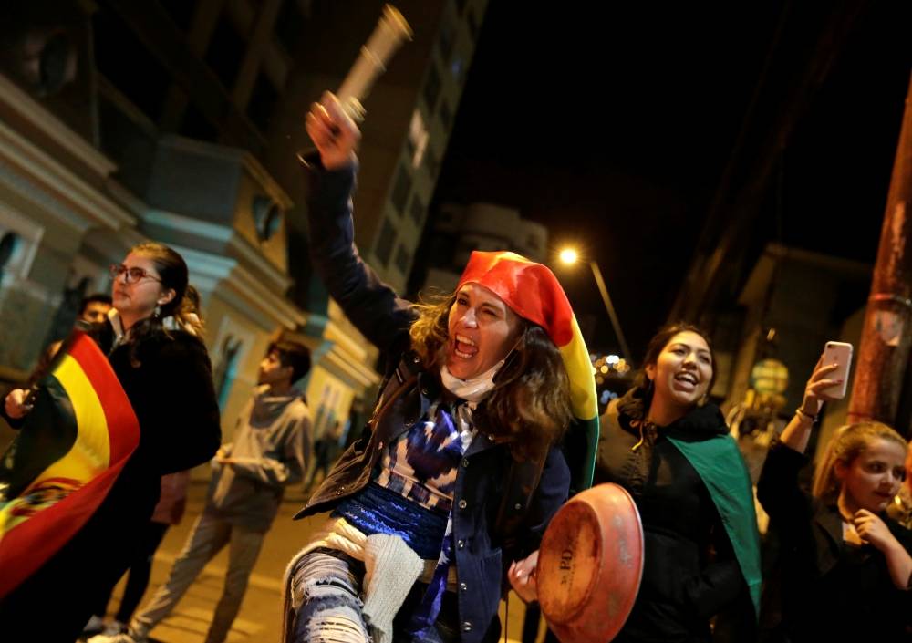 A woman bangs a pan during a demostration in La Paz, Bolivia. — Reuters