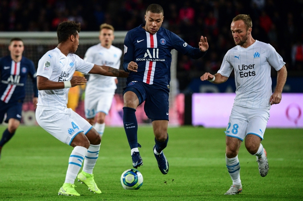 Paris Saint-Germain's Argentine forward Mauro Icardi (C) scores his team's second goal during the French L1 football match between Paris Saint-Germain (PSG) and Olympique de Marseille (OM) at the Parc des Princes stadium in Paris, on Sunday. — AFP