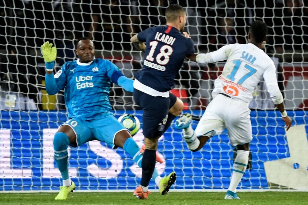 Paris Saint-Germain's Argentine forward Mauro Icardi (C) scores his team's second goal during the French L1 football match between Paris Saint-Germain (PSG) and Olympique de Marseille (OM) at the Parc des Princes stadium in Paris, on Sunday. — AFP