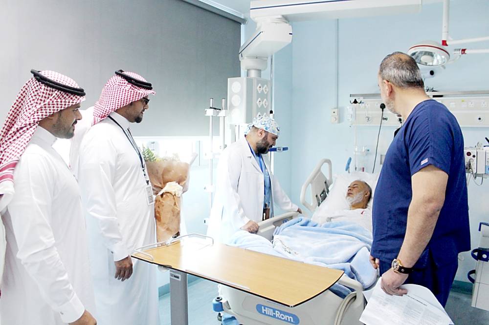 Medicos attend to the British tourist in Madinah. — Okaz photo