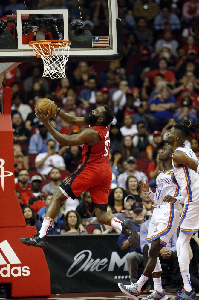 Russell Westbrook (0) of the Houston Rockets drives to the basket over Darius Bazley (7) of the Oklahoma City Thunder for a layup during the fourth quarter at Toyota Center in Houston, Texas, on Monday. — AFP