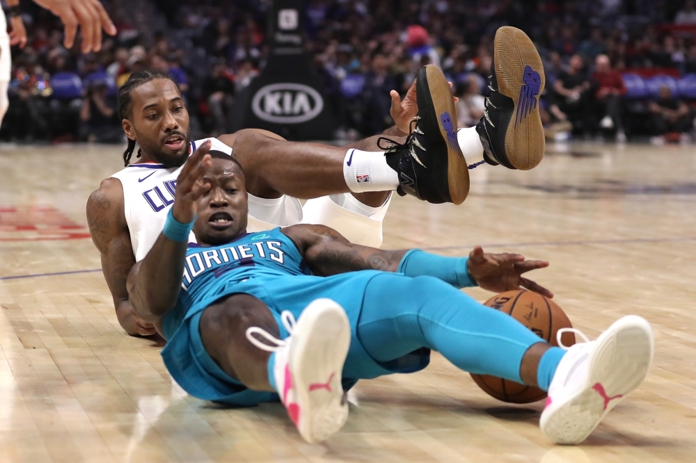 Russell Westbrook (0) of the Houston Rockets drives to the basket over Darius Bazley (7) of the Oklahoma City Thunder for a layup during the fourth quarter at Toyota Center in Houston, Texas, on Monday. — AFP