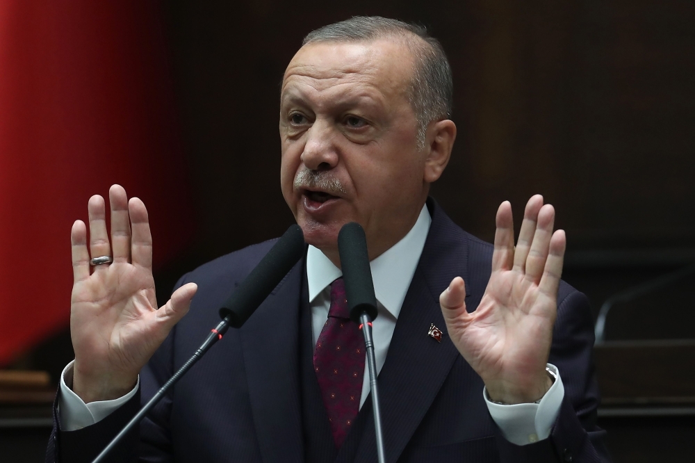 President of Turkey and leader of Turkey's ruling Justice and Development (AK) Party Recep Tayyip Erdogan gestures as he delivers a speech during his party's parliamentary group meeting at the Grand National Assembly of Turkey (TBMM) in Ankara, on Wednesday. — AFP